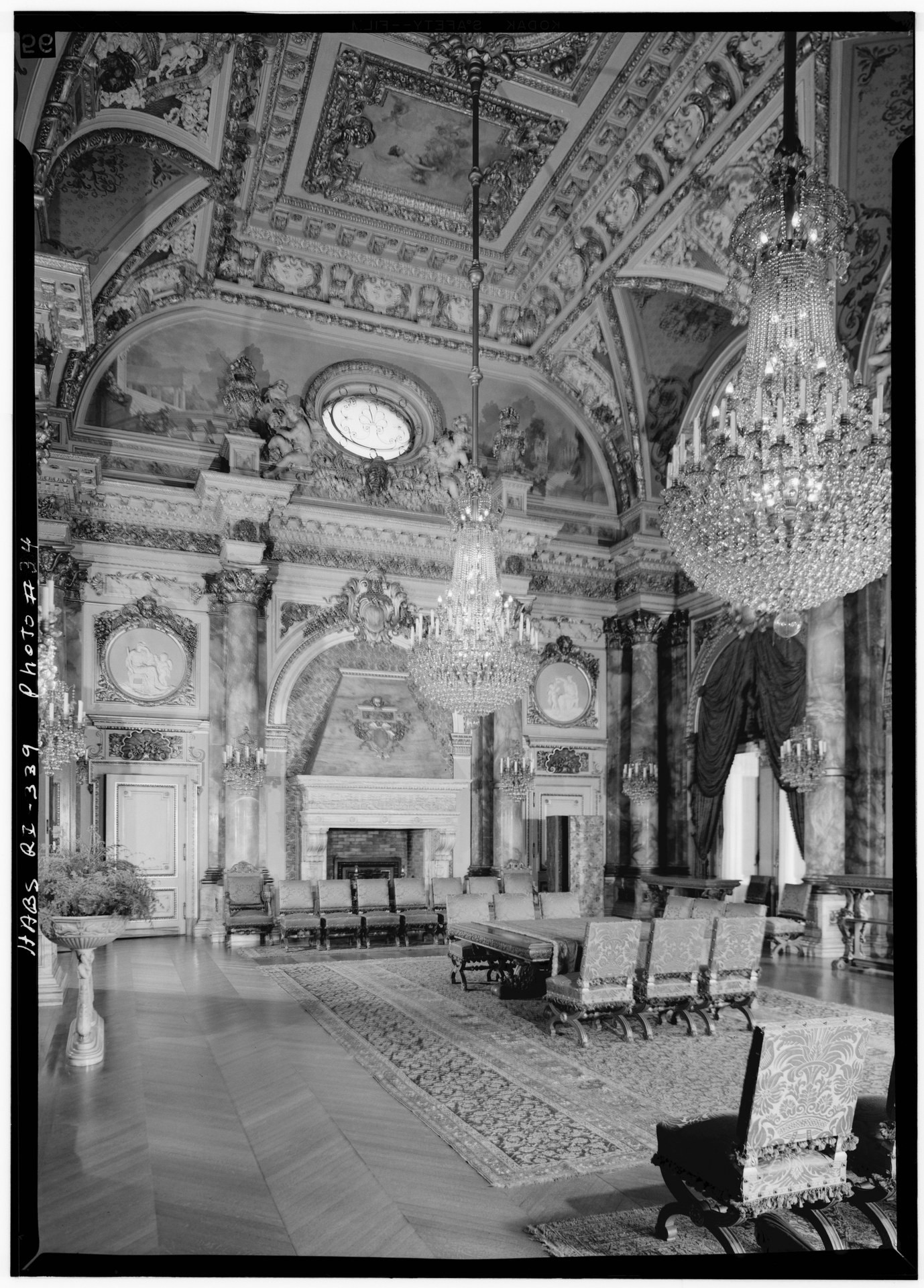 Historic survey view of The Breakers Dining Room with alabaster columns and chandeliers
