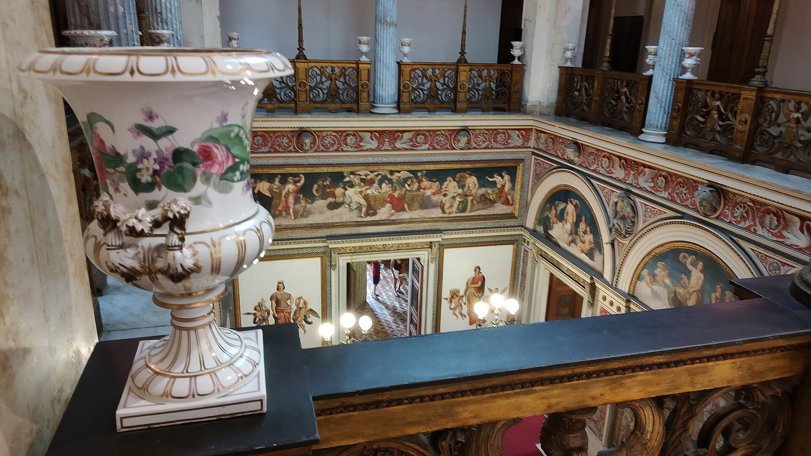 View from an upper gallery into a painted double-height interior at Palácio do Catete