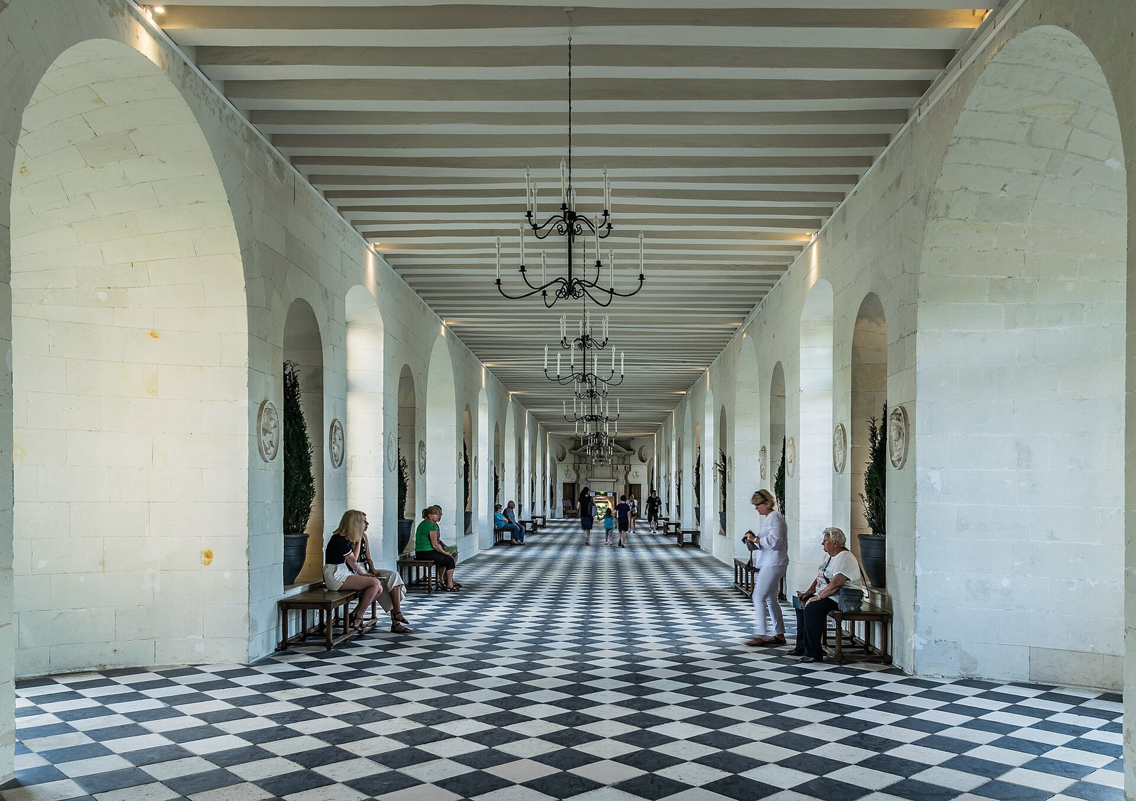 Chenonceau’s long gallery with a black-and-white floor and windows on both sides