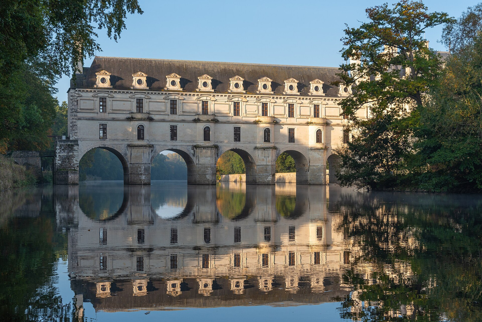 Château de Chenonceau and its long gallery reflected in the River Cher