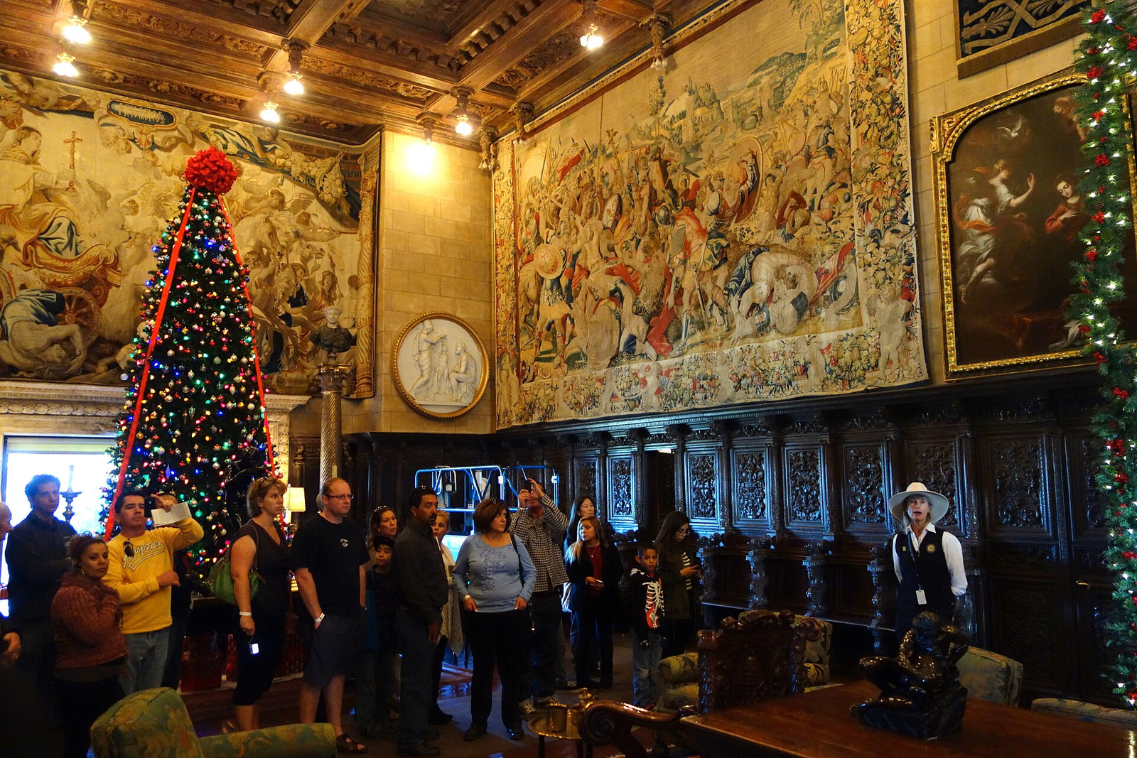 Assembly Room at Hearst Castle with carved wood, tapestries, sculpture, and seating