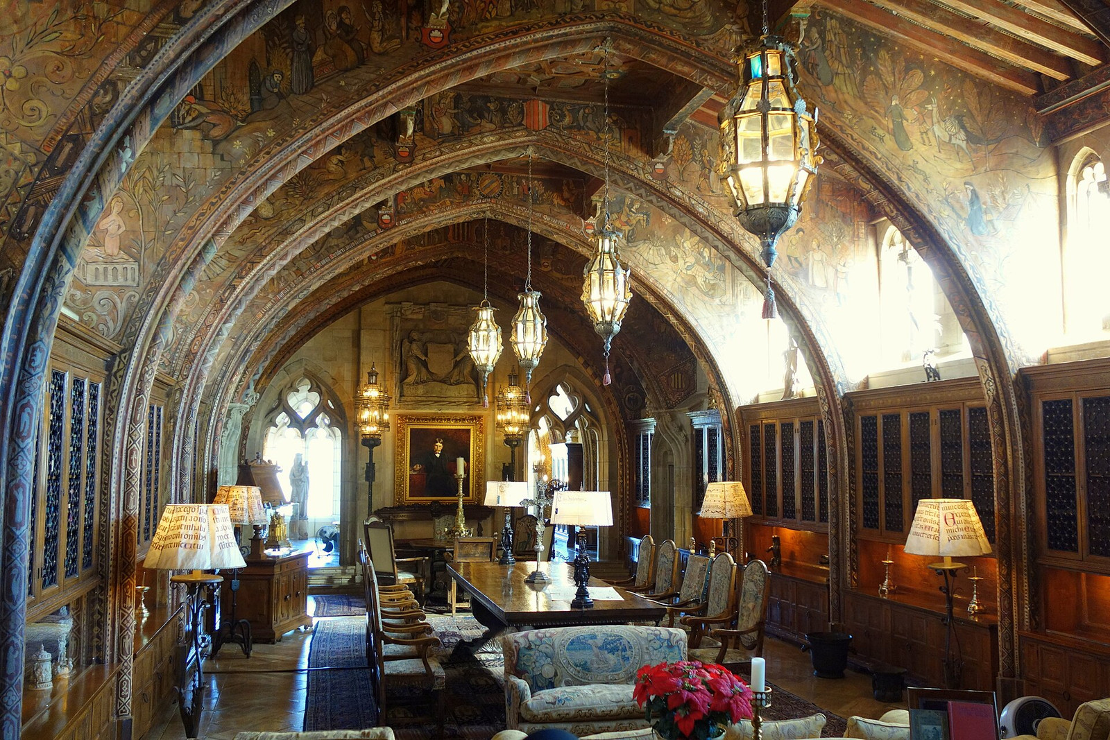 Gothic Study at Hearst Castle with an arched ceiling, long table, and lamps