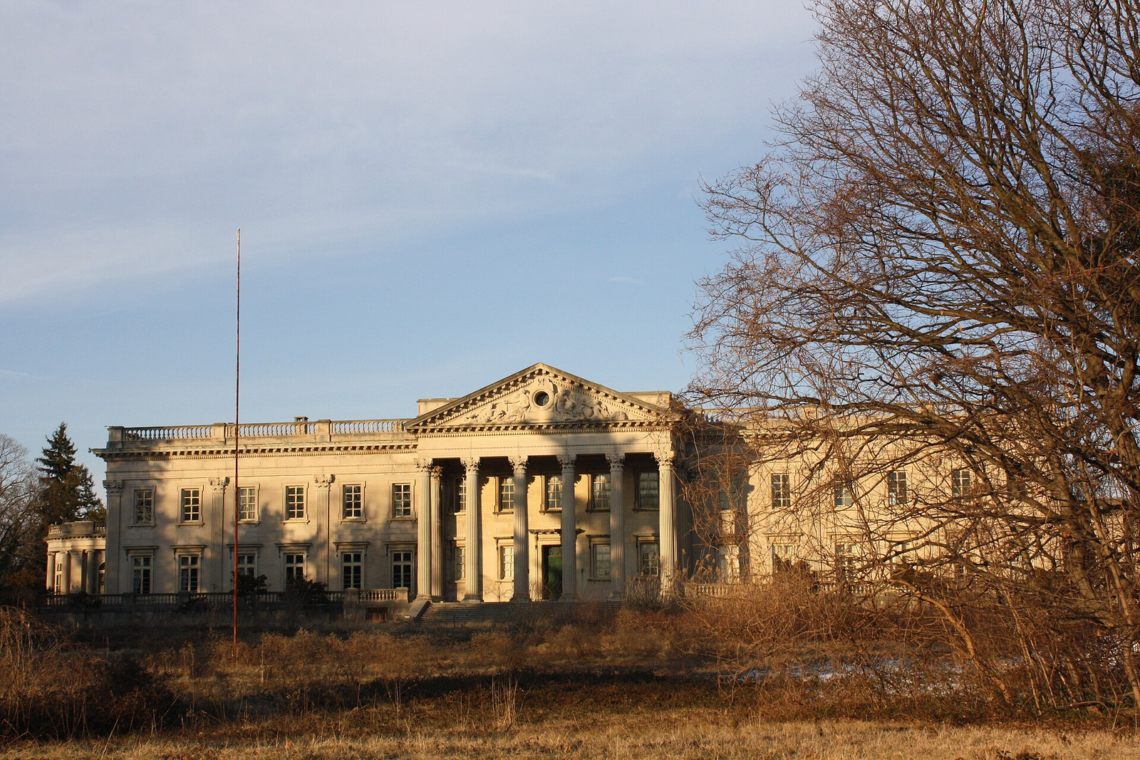 Lynnewood Hall in 2013 with weathered limestone and vegetation at the façade