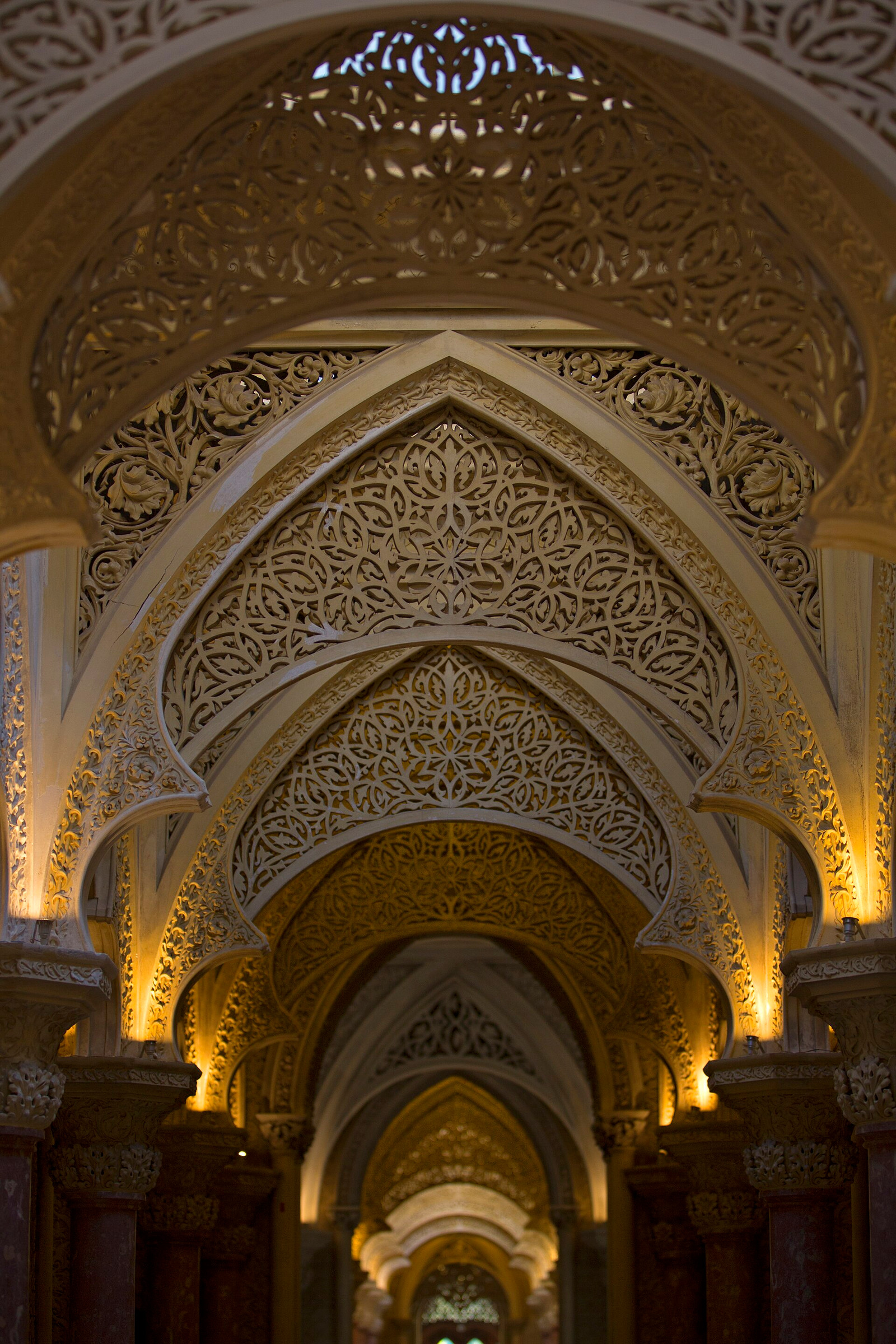 Monserrate interior seen through a sequence of carved pointed arches