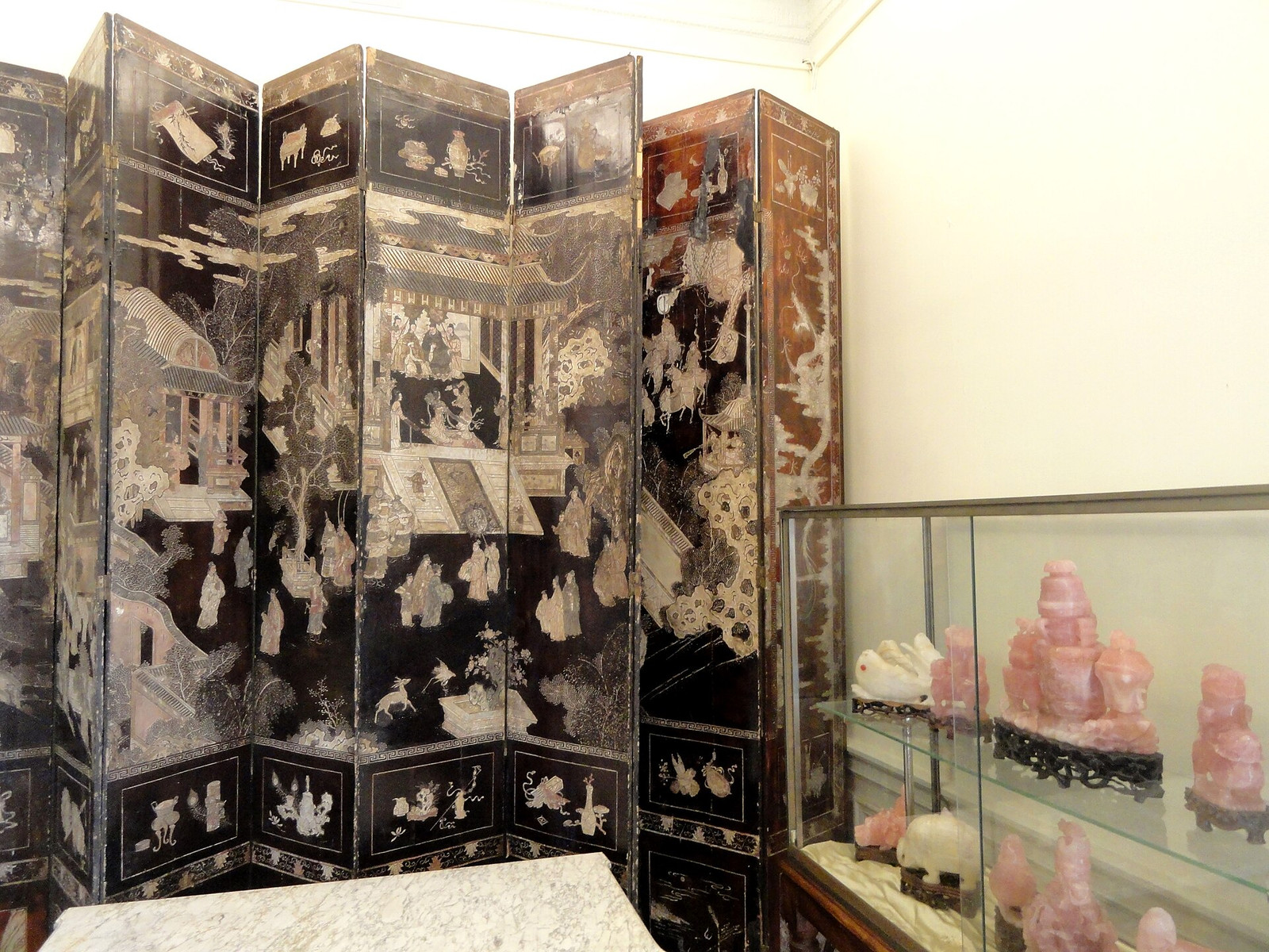 A black lacquer Coromandel folding screen displayed at Villa Ephrussi de Rothschild