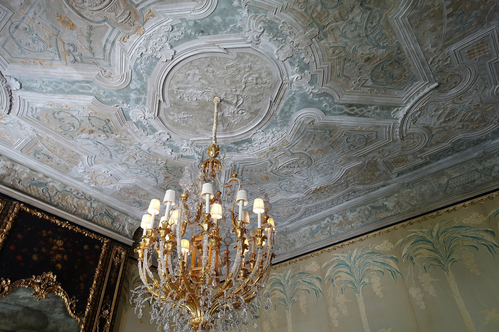 Vizcaya reception room with painted ceiling, carved furniture, and tall windows
